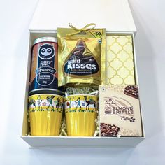 an open box containing coffee and snacks