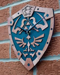 a clock mounted to the side of a brick wall with an image of a bird on it