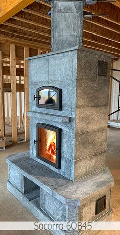 an outdoor fireplace in the middle of a building