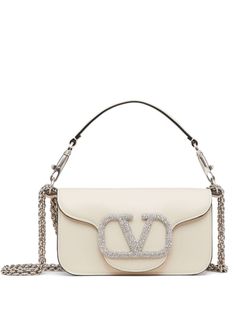 ivory white leather VLogo Signature silver-tone hardware Swarovski crystal embellishment chain-link shoulder strap single rounded top handle foldover top concealed magnetic fastening White Valentino Bag, White Luxury Bag, White Designer Bag, Girly Purse, Valentino Bag, Valentino Garavani Bag, Luxury Purses, Pretty Bags, Valentino Bags