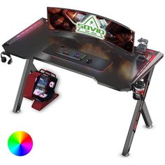 an image of a gaming desk with controller and game pad on it, next to a color wheel