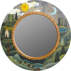 a round mirror with an artistic scene painted on it