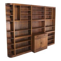 a large wooden bookcase next to a cabinet