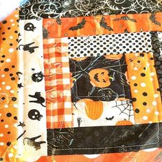 an orange and black patchwork halloween quilt