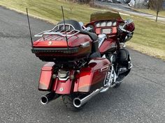 a red motorcycle is parked on the street