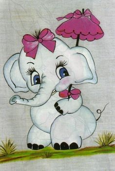 an elephant with a pink bow on its head