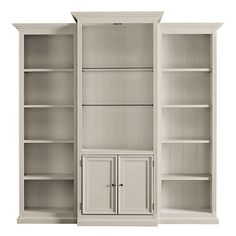 two white bookcases with doors and cupboards