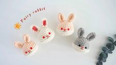 three crocheted rabbits sitting next to each other