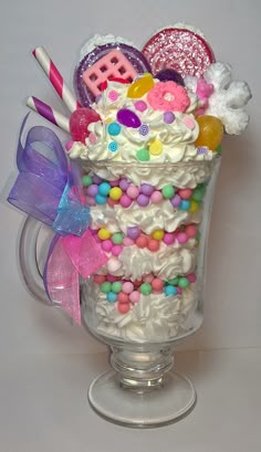 a cup filled with lots of candy and candies