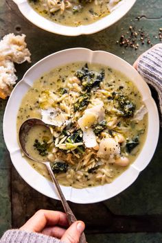 a white bowl filled with chicken and noodle soup