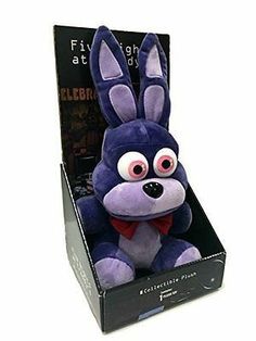 a purple stuffed animal in a black box