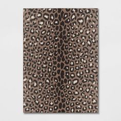 a brown and black animal print on a white wall