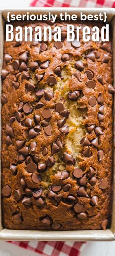 chocolate chip banana bread in a pan on a red and white checkered tablecloth