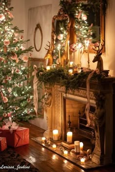 a decorated christmas tree in front of a fireplace with lit candles and presents on the mantle