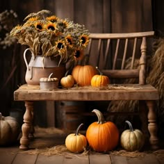 pumpkins and sunflowers sit on a wooden bench