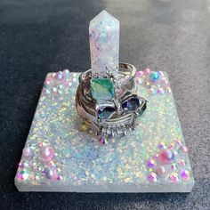 Opalescent White Ring Holder Stand. Made With Beautiful Opal Glitter That's Ultra Sparkly. Accents Include Pink And Blue Pearls And Aurora Borealis Rhinestones. Rings Not Included. Handmade And New. Geode Ring, Blue Pearls, Jewelry Organizers, Blue Pearl, White Ring, Aurora Borealis, Ring Box, Jewelry Organization, Ring Holder