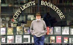 an older man standing in front of a book store with his hands on his hips