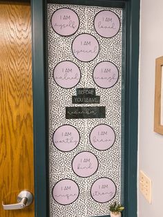 a door decorated with pink and black polka dots