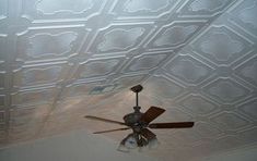 a ceiling fan in the middle of a room