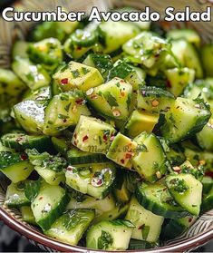 cucumber avocado salad in a brown bowl