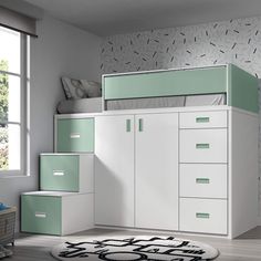 a white and mint green bedroom with drawers