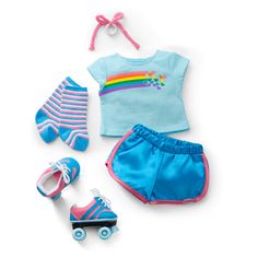 a baby doll outfit with shoes, socks and skateboard on a white surface next to it's accessories