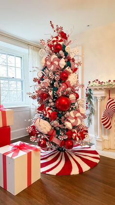 a red and white christmas tree decorated with candy canes, candies, or ornaments