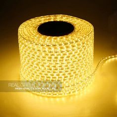 a roll of yellow led rope lights on a dark surface with the light turned off