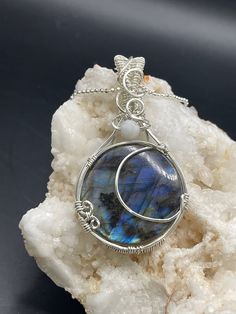 "This beautiful blue Labradorite pendant is about 2 1/2inches tall and 1 1/4 inch wide, it comes on a complimentary 18\" stainless steel chain and in a gift box, ready for gifting!  All of my pieces are made with high quality wire from Riogrande. These are not costume pieces that will chip away or rust over time. They will last forever if taken care of, which is why I include a free polishing cloth with every order. Quality is very important to me! If you have any questions, I'm happy to help." Moon Phase Oval Necklace For Gifts, Oval Moon Phase Necklace As A Gift, Oval Moon Phase Necklace For Gift, Oval Moon Phase Necklace Gift, Spiritual Moon-shaped Collectible Jewelry, Moonstone Pendant Jewelry Gift, Moon Phase Spiritual Jewelry, Moonstone Round Pendant Jewelry For Gift, Moon Shaped Necklace With Large Pendant For Gift