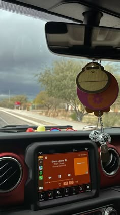 the dashboard of a car with an electronic device attached to it's dash board