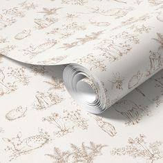 a white wallpaper with brown flowers and plants on the side, it's very soft