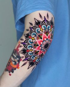 a person with a colorful tattoo on their arm