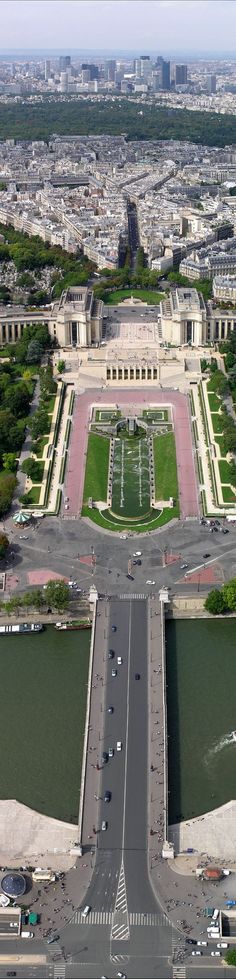 an aerial view of the eiffel tower in paris, with cars driving down it