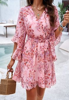 Flirty, flowy, and fabulously femme, our Sienna Floral Wrap Mini Dress is a must-have for any fashion-forward babe. Made with lightweight chiffon fabrication, this dress will keep you cool and chic all season long. Embrace your inner flower child with this playful and versatile piece. Size Guide: Model is 5’8” tall, and has a 33.4” bust, 26.4” waist, & 35.4” hips. She is wearing a S / US 4 / AU 8. This dress is true to size. Material: 100% Polyester. Feature: V-Neckline. Wrap front with waist tie. Short ruffle sleeves. Floral Print. Chiffon Fabrication. Mini length. Care Instructions: Machine wash / Cold hand wash Floral Flowy Dress Short, Flowy A-line Mini Dress With Floral Print, Chic Flowy Floral Dress For Casual Wear, Chic Flowy Floral Dress For Dress Down, Feminine A-line Chiffon Mini Dress, A-line Chiffon Dress For Vacation, Feminine A-line Floral Dress For Vacation, Flowy Mini Dress With Floral Print, Flowy Floral Mini Dress