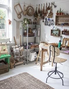 a room filled with lots of different items and decor on the walls, including shelves