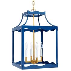 a blue and gold lantern hanging from a ceiling fixture with three candles in the center