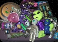 a pile of toys and other items on a table