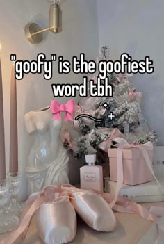 a white christmas tree with pink bows and candles next to it is the words,'go