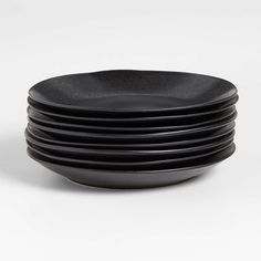 black plates stacked on top of each other