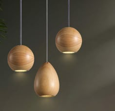 three wooden balls hanging from the ceiling