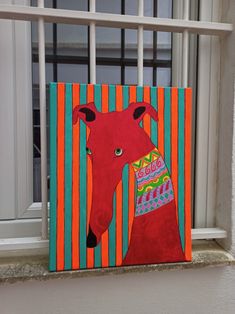 a painting of a red bear on a colorful striped background by a window sill