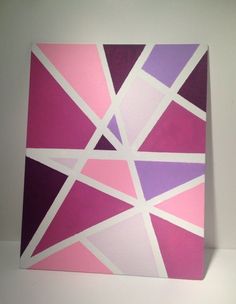 a pink and purple painting on a white wall