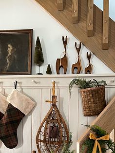 christmas stockings hanging on the wall under stairs