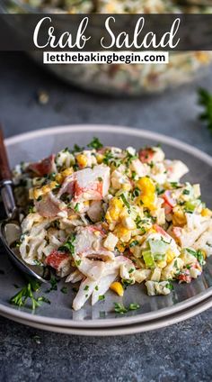 a plate with pasta salad on it and a serving spoon