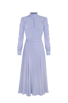 A beautiful lilac, pure Italian silk crepe, soft midi dress.The original inspiration derives from a late 1940’s vintage tea dress, featuring beautiful 7/8 length sleeves with a buttoned cuff. We have re-imagined this design to have it skim over the bodice with a fluid gentle soft movement throughout the skirt, from the hips to the hemline. The silhouette is contoured around the waist, with a detachable belt and softly tailored bodice part. Self covered dome buttons add an immaculate finish to th Luxury Long Sleeve Silk Workwear Dress, Lilac Silk Dress Long Sleeve, Fall Gowns, Luxury Silk Long Sleeve Shirt Dress, Suzannah London, Luxury Long Sleeve Purple Midi Dress, Luxury Blue Button-up Dress, Silk Crepe Dress, Vintage Tea Dress