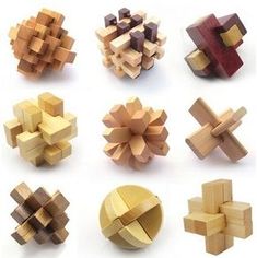 several different types of wooden puzzles on a white background, including one with an odd shape