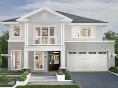 a white two story house with lots of windows and bushes in front of the garage