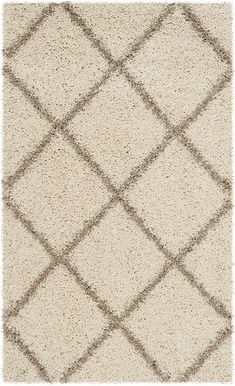 a white rug with brown squares on the bottom and tan carpeting in the middle