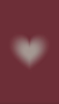 a blurry image of a heart in the middle of a dark red square frame