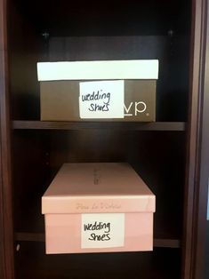 two boxes are sitting on top of each other in a bookcase that is labeled wedding stories and wedding shoes